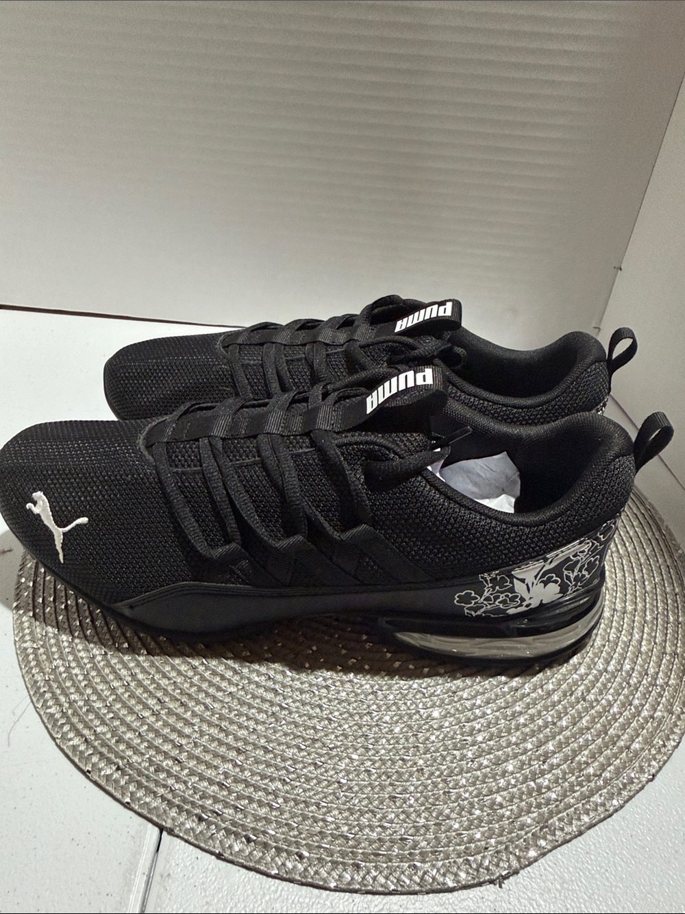 Puma Black Sneakers with White Logo and Floral Heel Accent